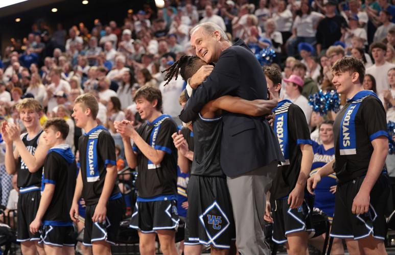 Coach Dave Hollenbeck embracing a West Central player after the state championship